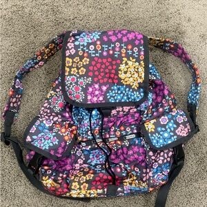 Lesportsac drawstring backpack with multicolor floral and heart print.